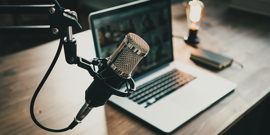 Computer on a desk with a microphone