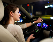 Woman turns right while driving at night