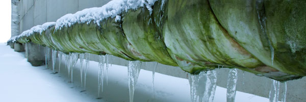Outdoor pipe covered in ice