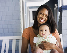 Woman with baby on porch swing