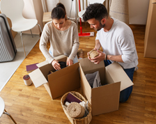 Couple unpacks boxes in new home