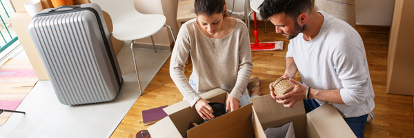 Couple unpacks boxes in new home