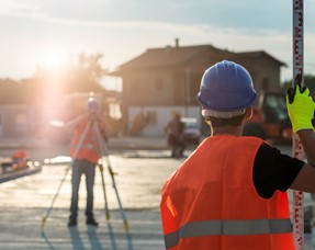 Surveyors working in the sun