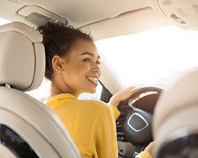 interior shot of woman driving SUV