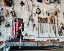 Workbench with tools hanging on the wall in a home garage